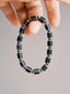 Men’s black onyx bracelet, Urban Stoic Series Black Verdict, minimal black-silver jewelry aesthetic.