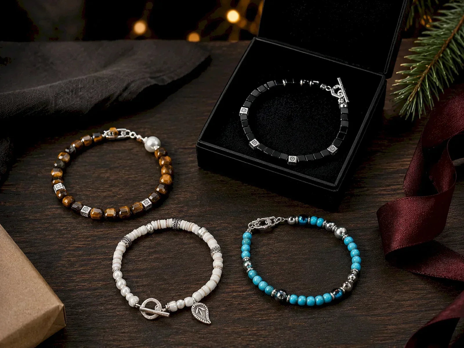 Christmas gift selection of four handcrafted men's bracelets with black onyx, tiger eye, mother-of-pearl, turquoise and silver details