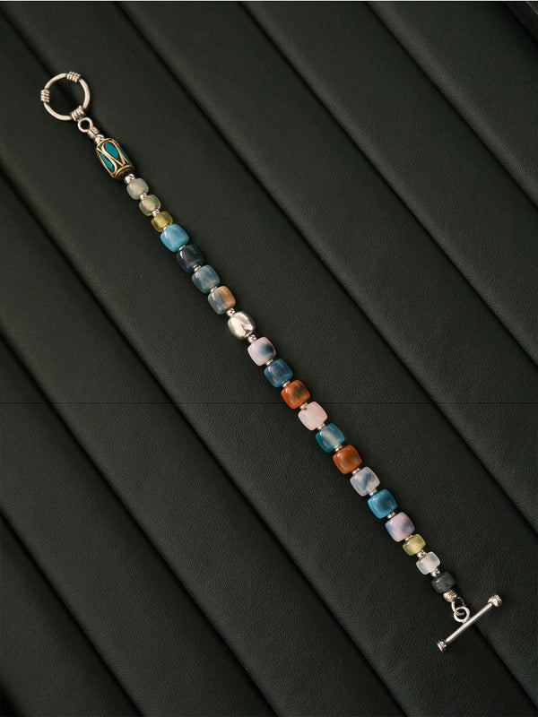Artistic display of Urban Dreamer bracelet, handmade multicolor agate jade and silver bracelet for men with gallery-style presentation