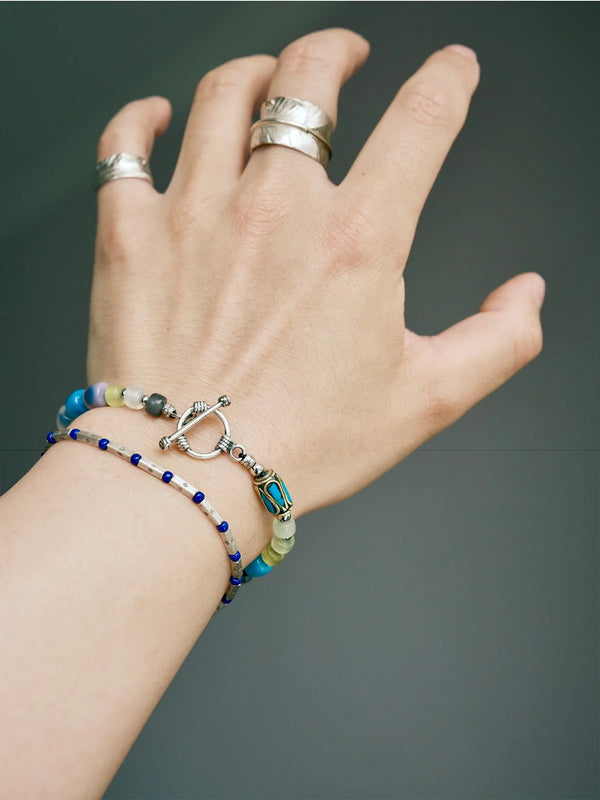 Stacked bracelet look featuring a handmade multicolor agate bracelet for men, designed for modern wrist layering and self-expression
