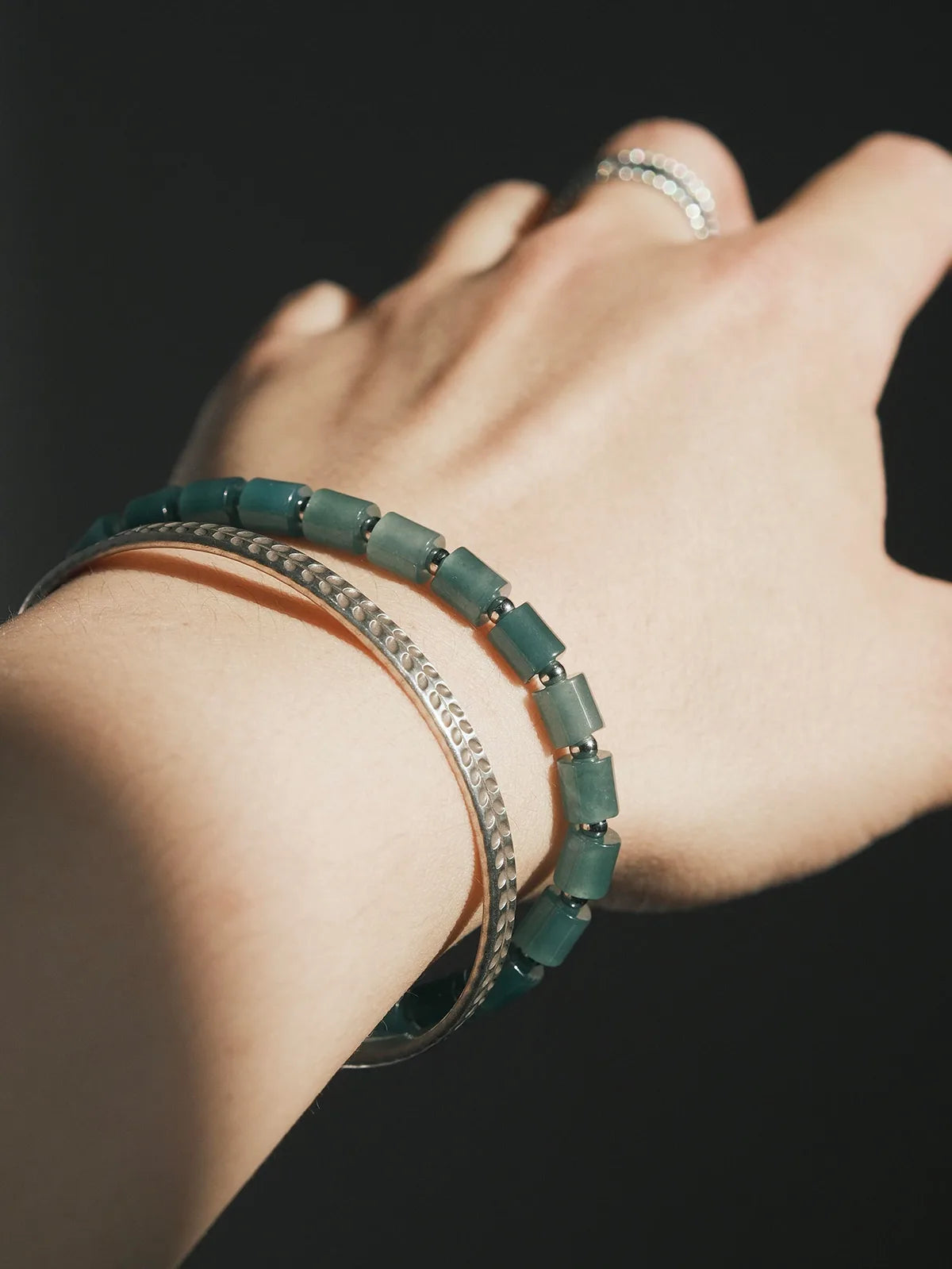 Green aesthetic feicui jade bracelet for men symbolizing calm energy, emotional balance, and modern minimalist identity expression.