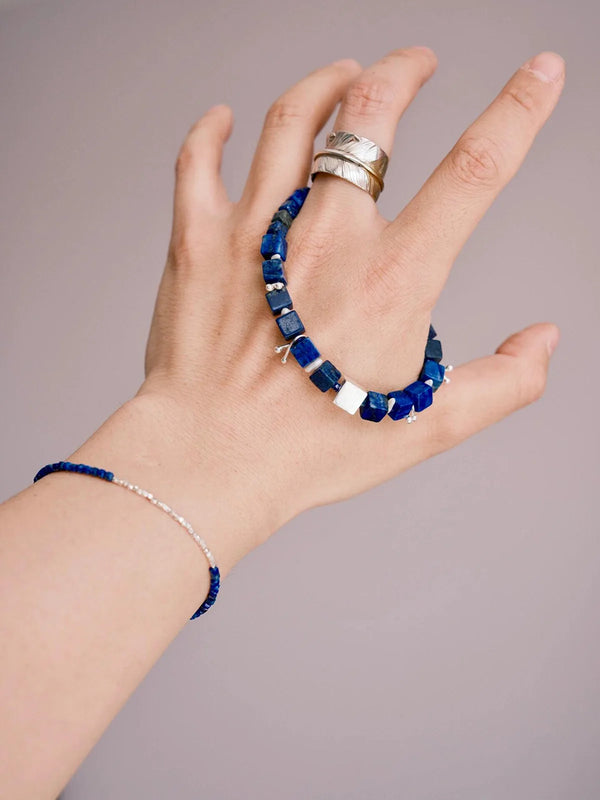 Lapis lazuli sterling silver bracelet for men styled across hand and wrist