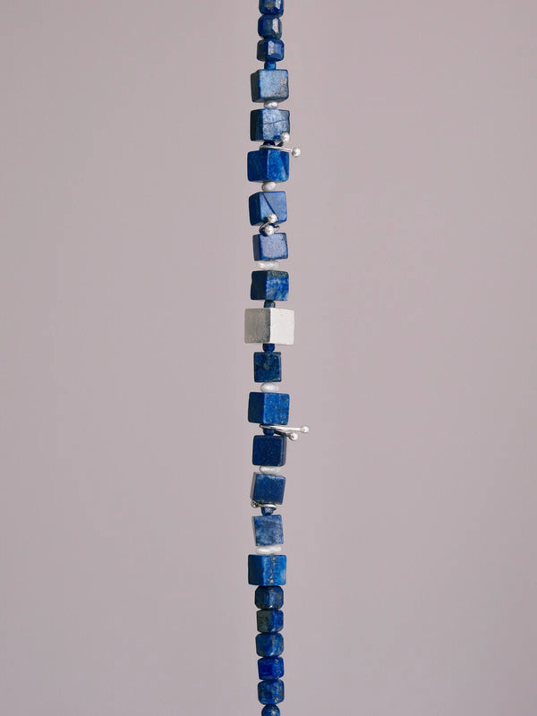 Detailed view of lapis lazuli cube beads and sterling silver square detail