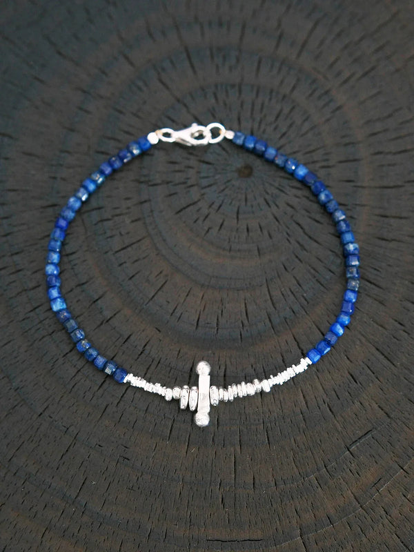 Lapis lazuli sterling silver cross bracelet displayed in circular form