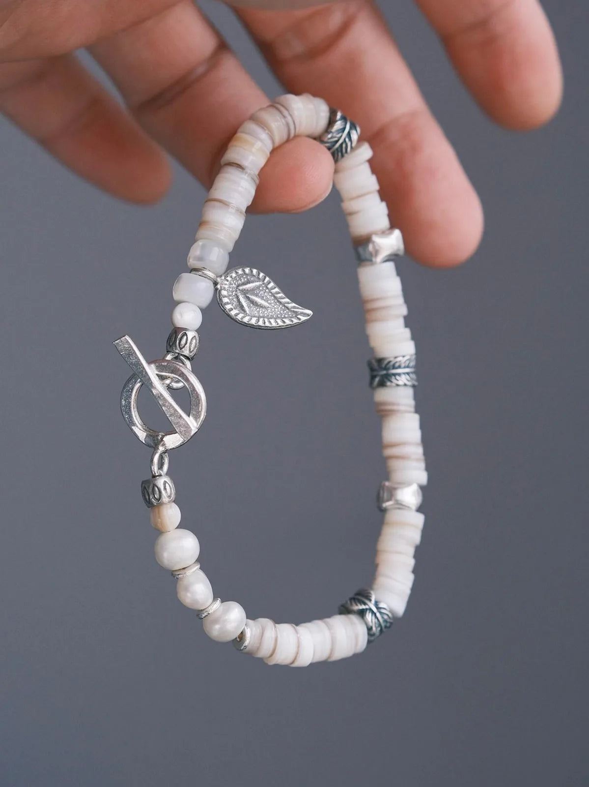 Identity Series | Broken Halo | Shell, Pearl & Sterling Silver Feather Bracelet Main image