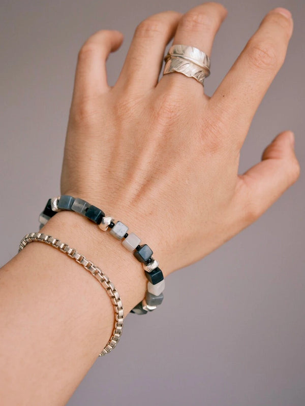 Stacked men’s bracelet look with jade, silver, and chain bracelet, designed for urban stoic style and daily confidence.