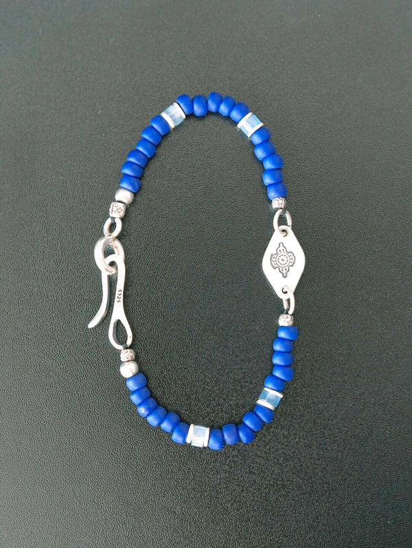 Moody minimal portrait with blue bracelet accent, Identity Series Klein Blue Boy, masculine jewelry aesthetic