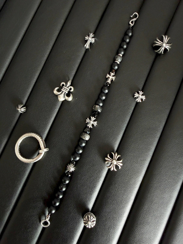 Black and white masculine portrait with dark minimal men’s jewelry mood, Urban Stoic aesthetic.