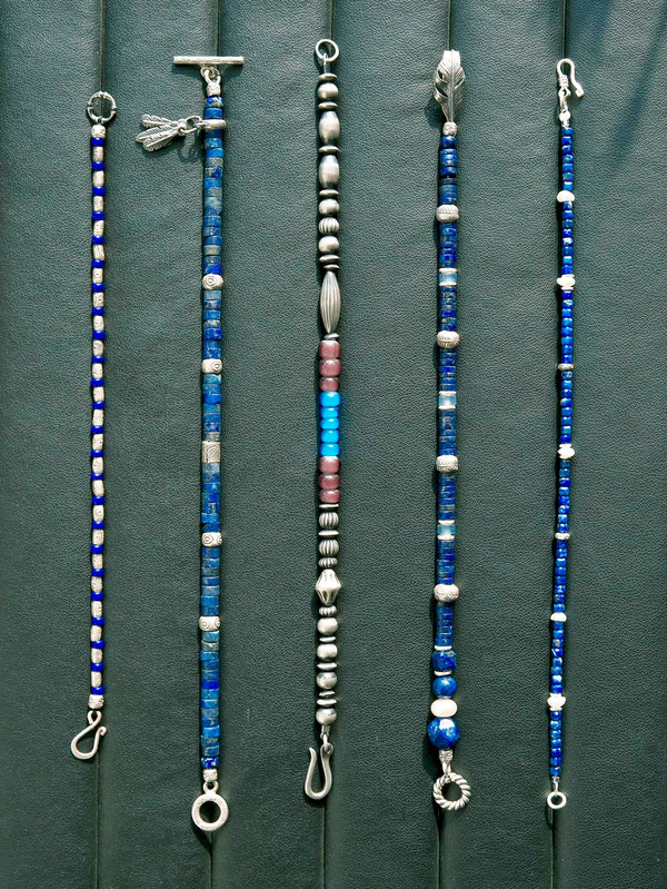 Gift-ready men’s lapis lazuli bracelet with aquamarine and silver feather detail, designed as a meaningful gift for him.