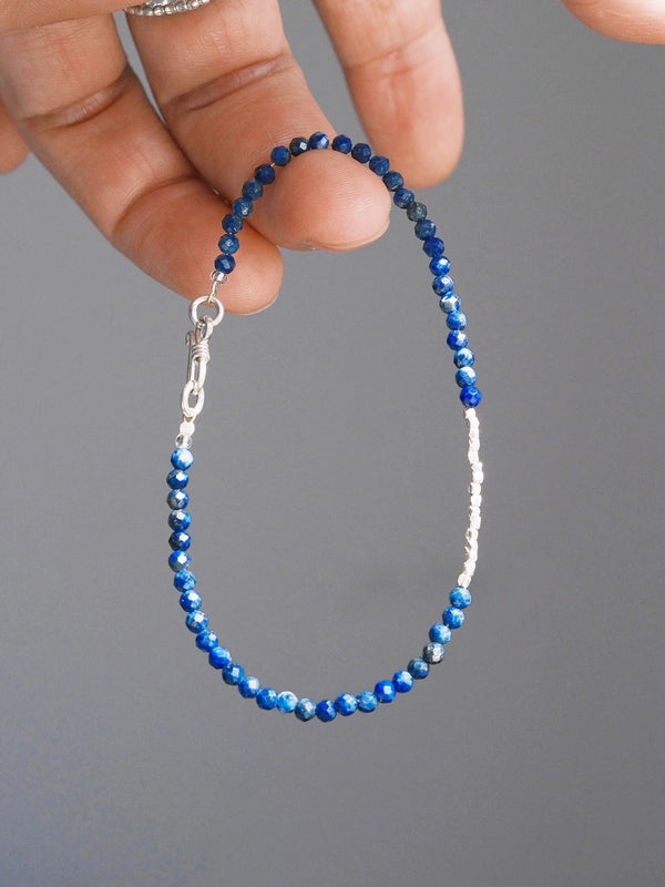 Men’s lapis lazuli bracelet, Identity Series Blue Current, minimal jewelry aesthetic with sterling silver beads for refined daily wear.
