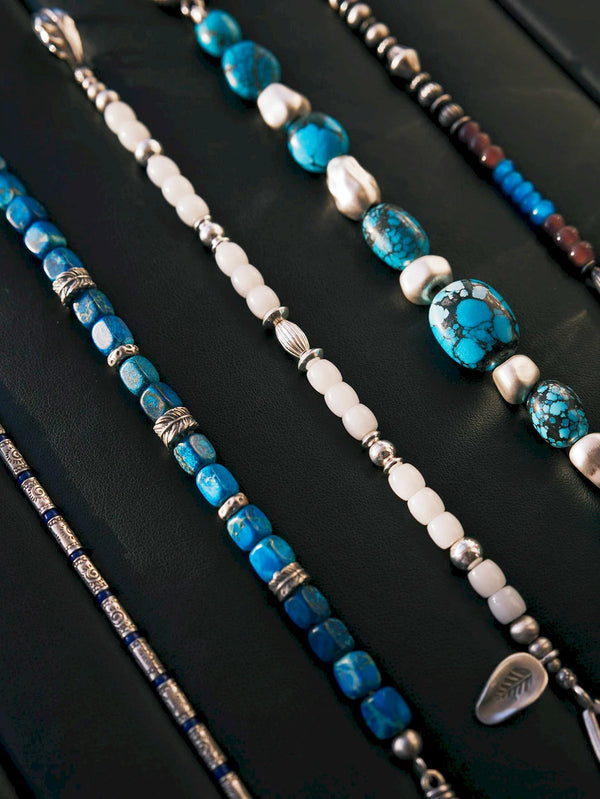 Meaningful gift for him featuring Identity Series Ocean Wing men’s bracelet with blue stone beads and sterling silver feather details.