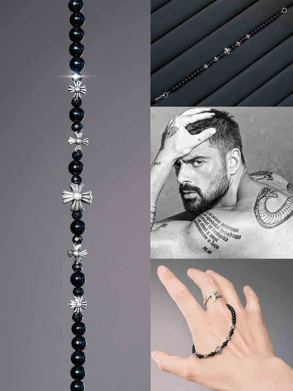 Flat lay of men’s black onyx and black spinel bracelet with sterling silver cross-heart details, styled on a dark surface for an urban stoic jewelry look