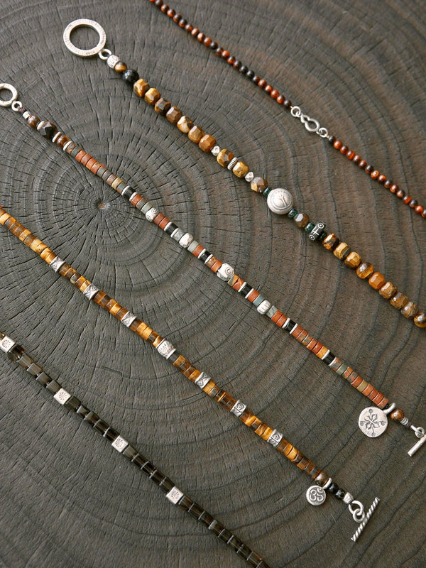 Gift-ready men’s tiger eye bracelet with silver details and handwritten card, designed as a meaningful gift for him.