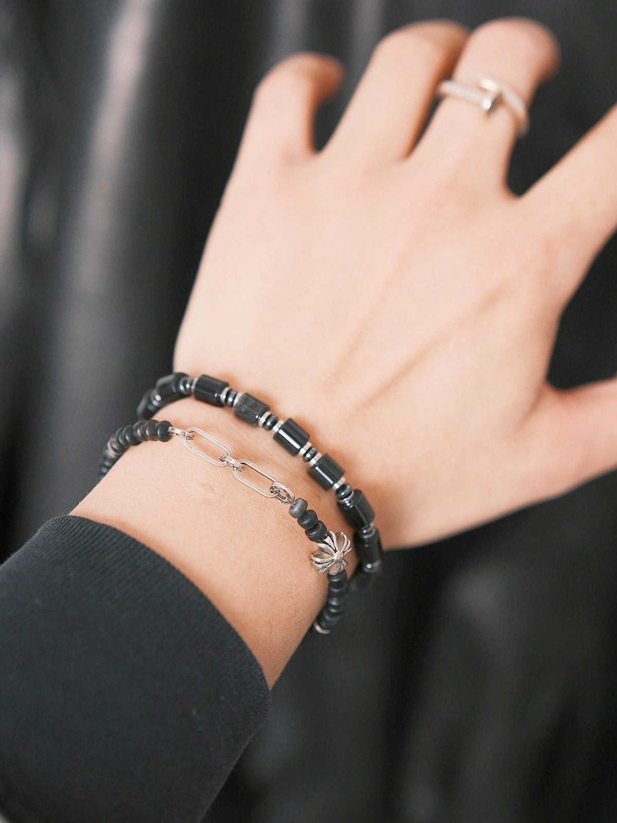 Close-up wrist shot of Urban Stoic Series Black Verdict bracelet, black onyx and hematite beads, minimal men’s jewelry.