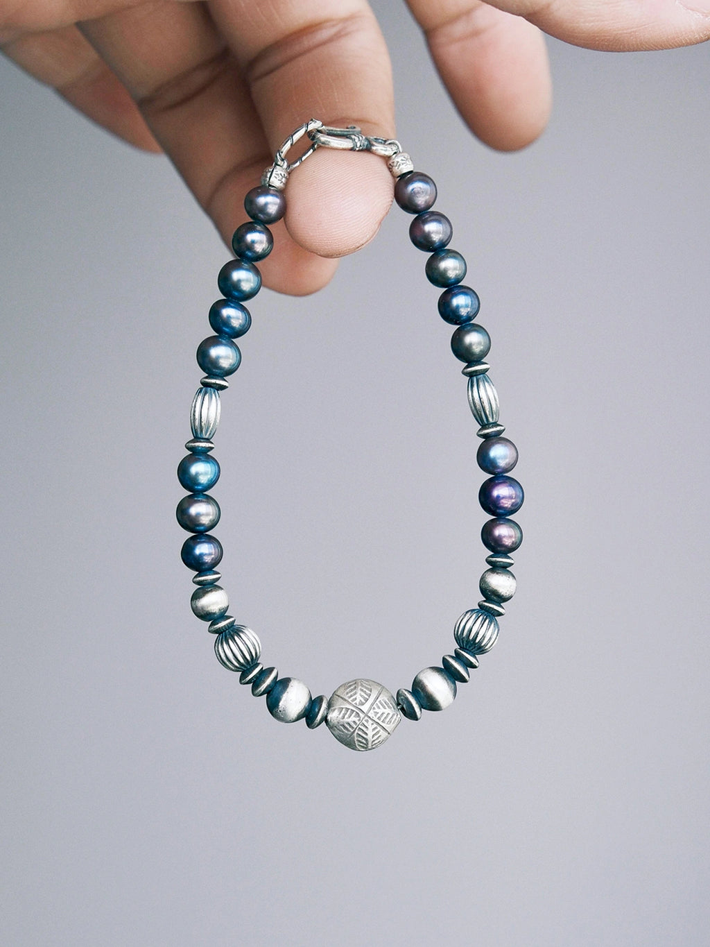 Men’s pearl bracelet, Urban Stoic Series Pearl Current, minimal jewelry aesthetic with natural pearls and hammered silver.