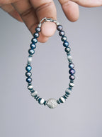 Men’s pearl bracelet, Urban Stoic Series Pearl Current, minimal jewelry aesthetic with natural pearls and hammered silver.