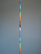 Straight layout of thin rainbow colored-glaze bracelet, sterling silver clasp, modern men’s beaded bracelet design