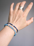 Stacked men’s bracelets with Blue Shoal blue chalcedony bracelet and slim lapis bracelet, refined daily wrist style