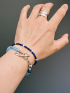 Blue Shoal blue stone bracelet worn with casual knitwear, sterling silver details and relaxed weekend style for men