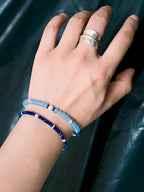 Blue Shoal bracelet styled for coastal travel, blue chalcedony and sterling silver details, relaxed masculine summer jewelry