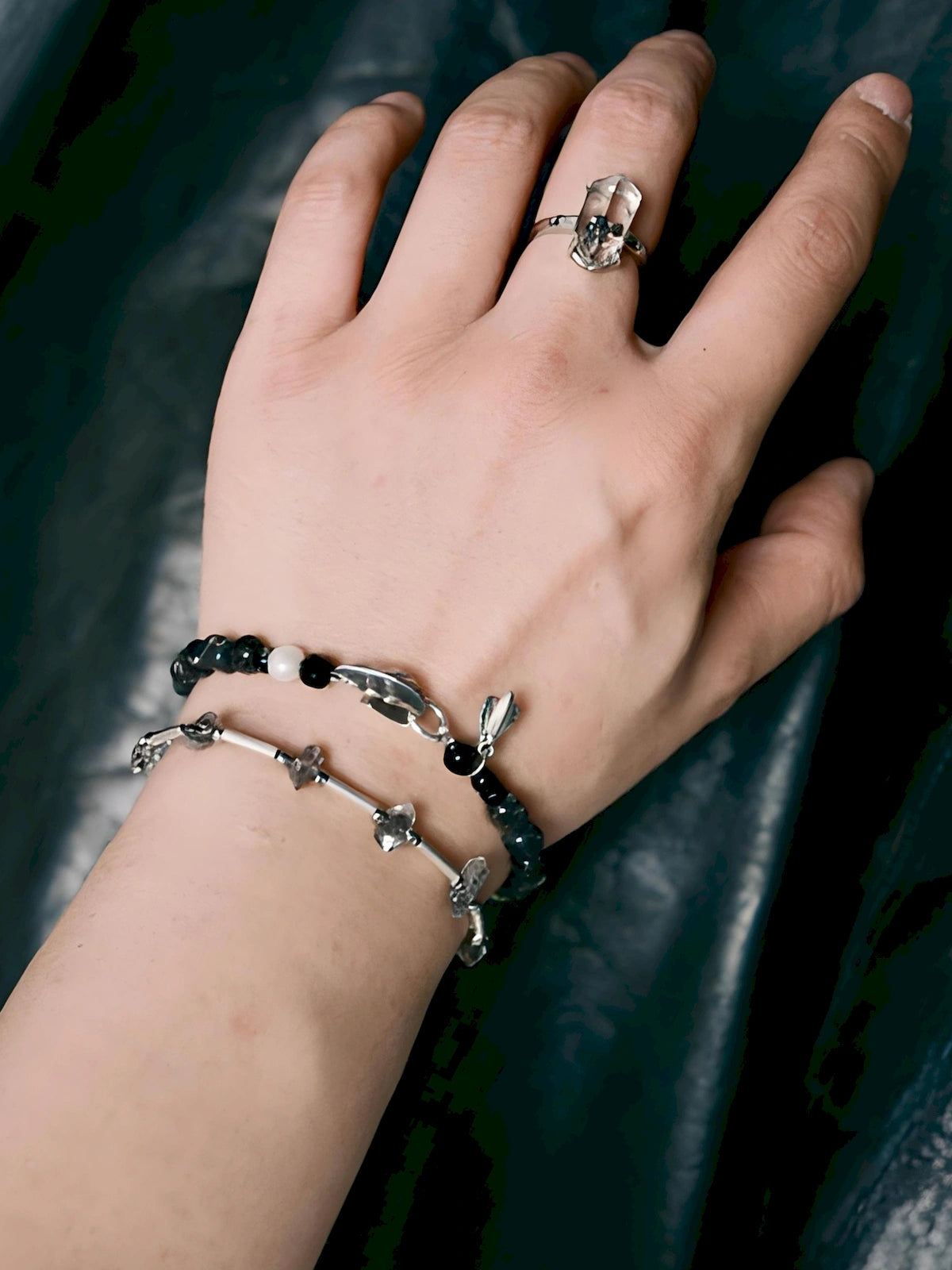 Men’s bracelet stack with Herkimer quartz, sterling silver, black beads, and masculine layered jewelry style