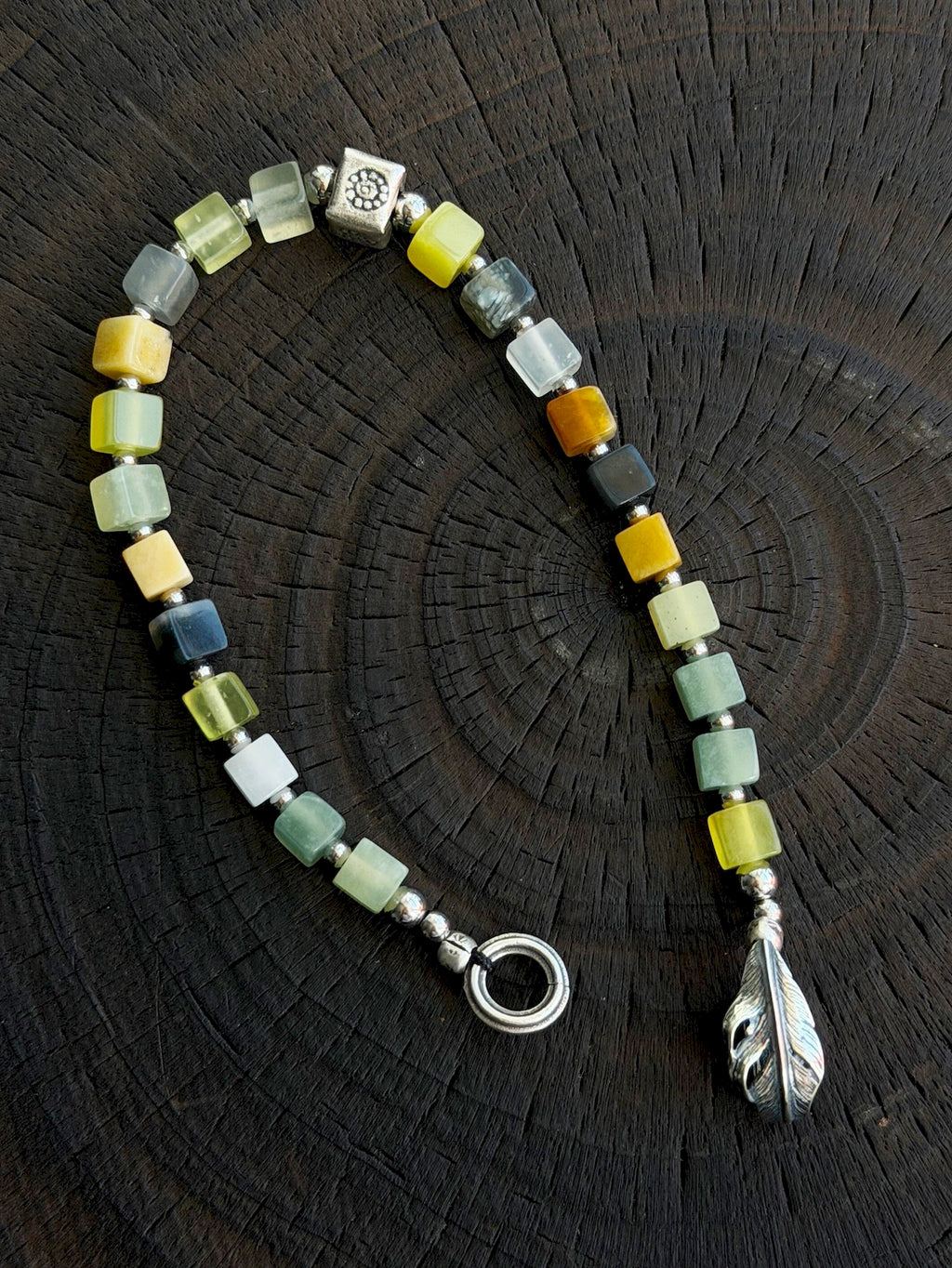 Close-up of natural Xiuyu jade square beads, 925 silver and titanium steel beads, refined finish bracelet