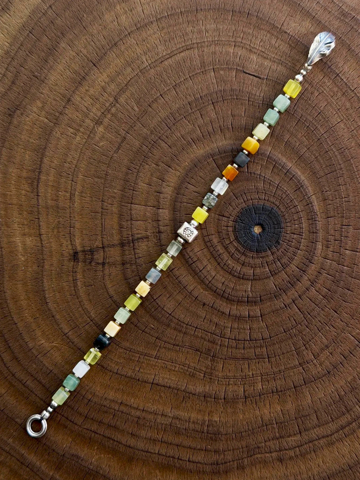 Close-up of natural Xiuyu jade square beads, 925 silver and titanium steel beads, refined finish bracelet