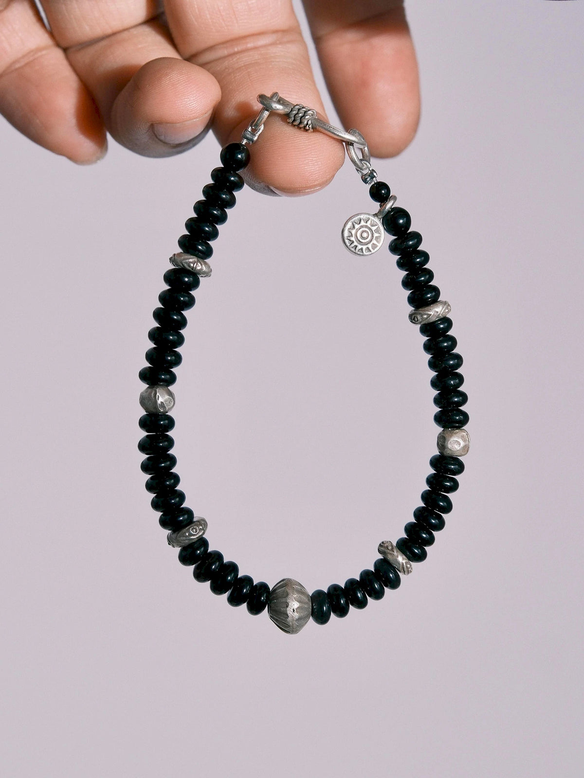 Men's black onyx and hammered silver bracelet from the Urban Stoic Series on a clean light background